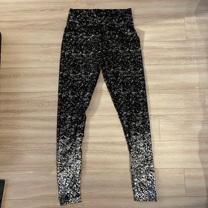 Black and silver metallic leggings. SHEIN